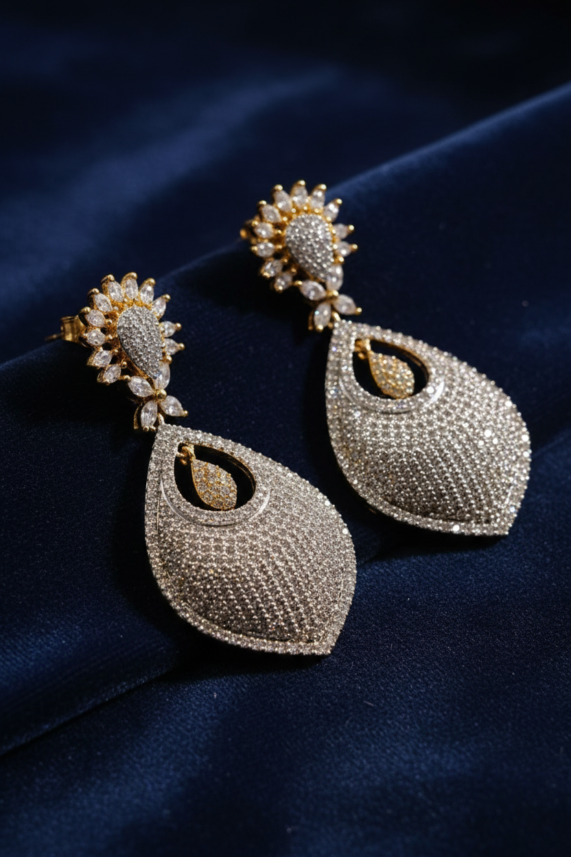 CZ drop earrings on textured background