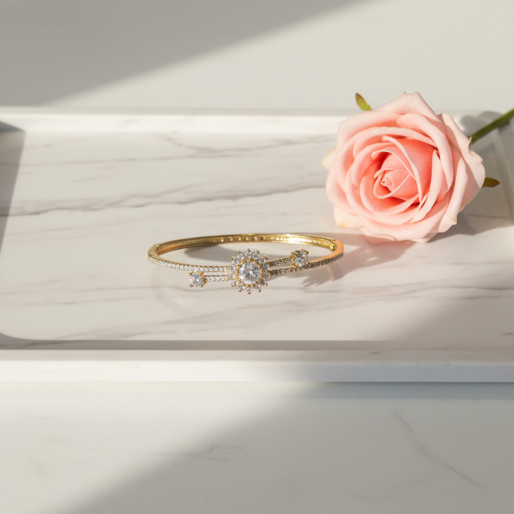 AD Bracelet Flatlay on Marble Tray with Pink Rose