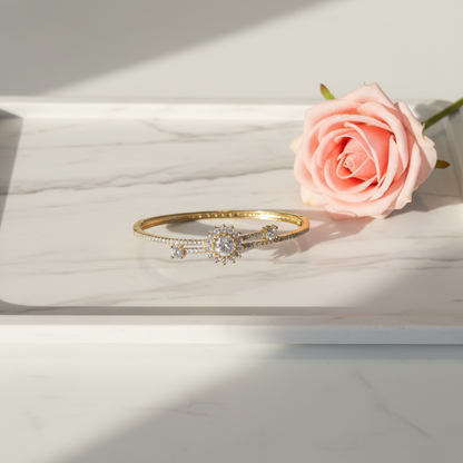 AD Bracelet Flatlay on Marble Tray with Pink Rose