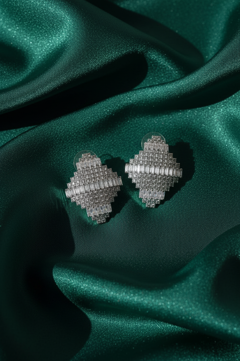 Flat lay on emerald green silk fabric